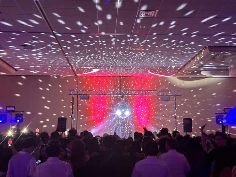 LED light show with a disco ball at Operation Glow event, creating vibrant patterns for an energetic.