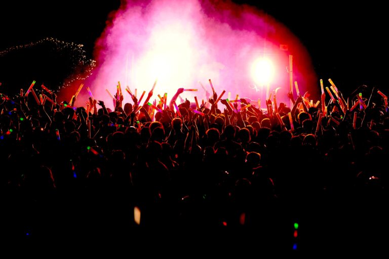 Glow party with vibrant lights and energetic crowd at Operation Glow event.